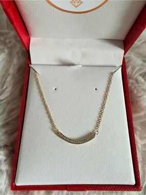 Yellow Gold Over Curved Bar Diamond Necklace

925 Sterling Silver